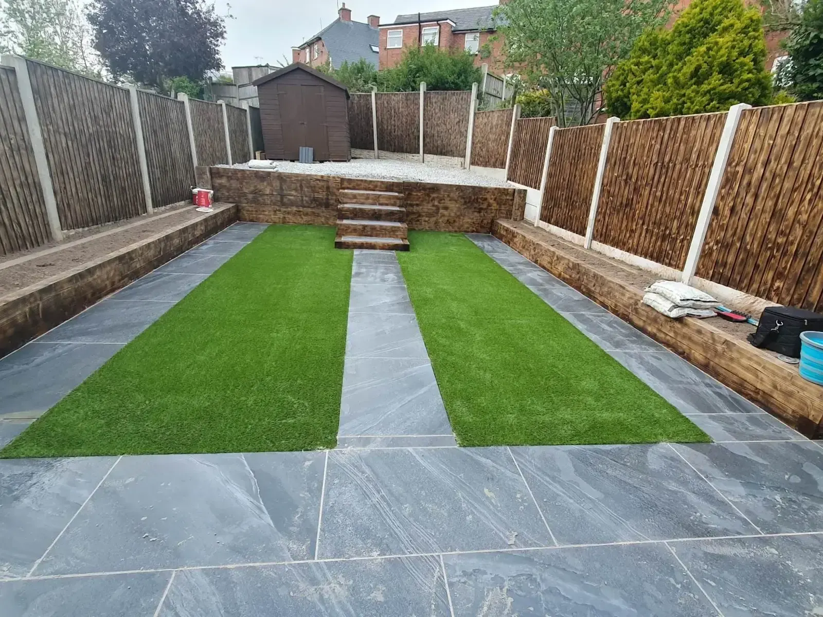 Garden with artificial grass and paving