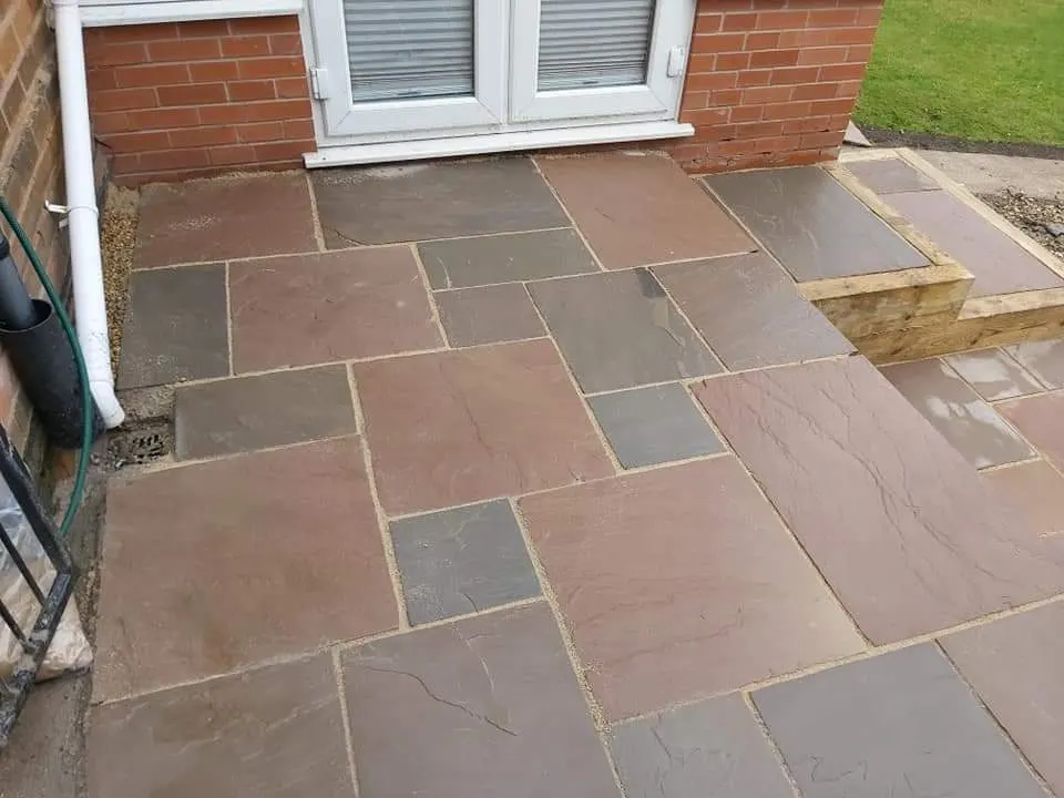 Autumn brown sandstone patio with a sleeper step