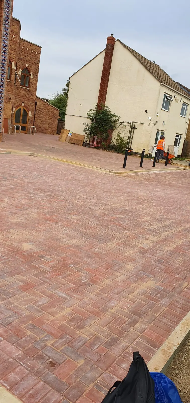 Block paving courtyard in front of new houses