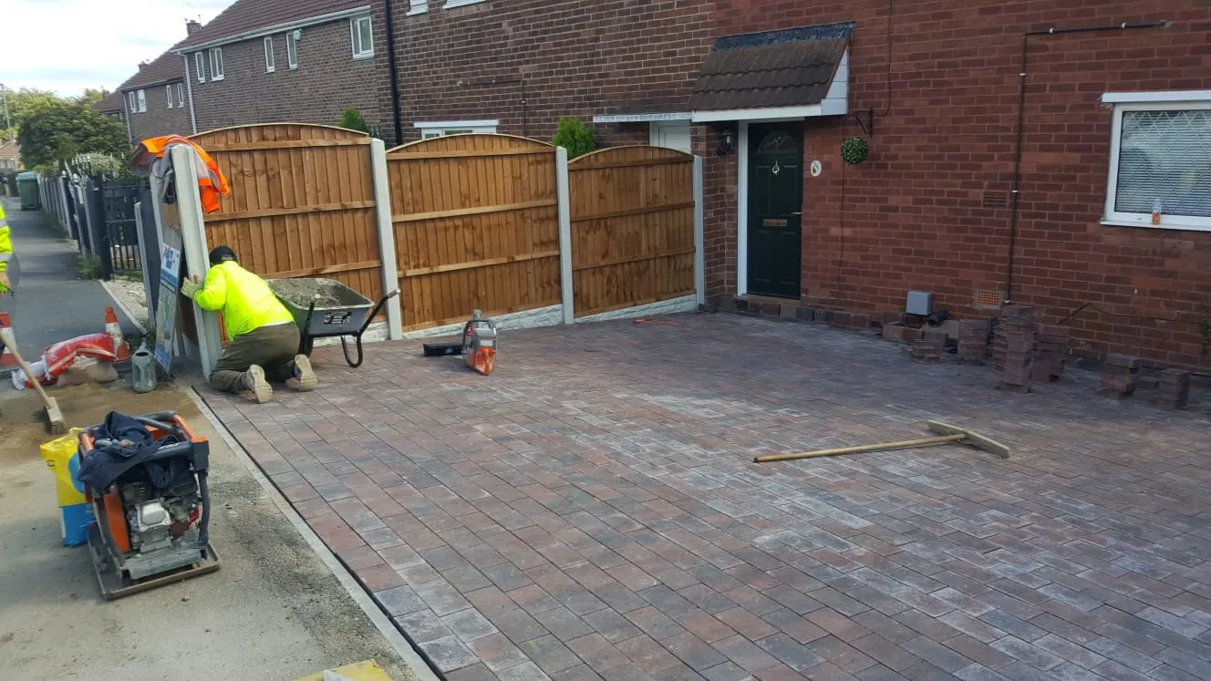 Our team laying a block paving driveway