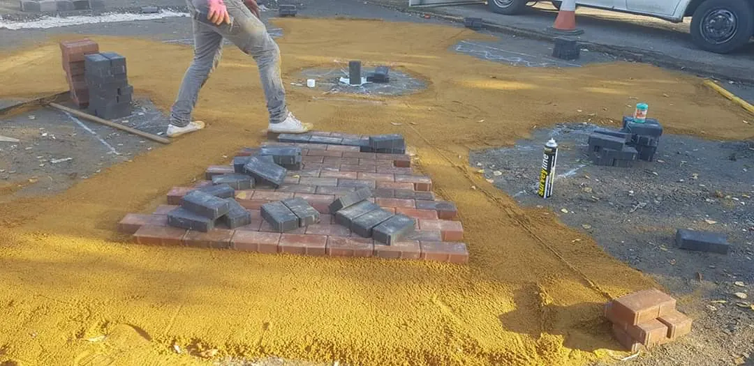 Block paving feature being laid on a sand bed