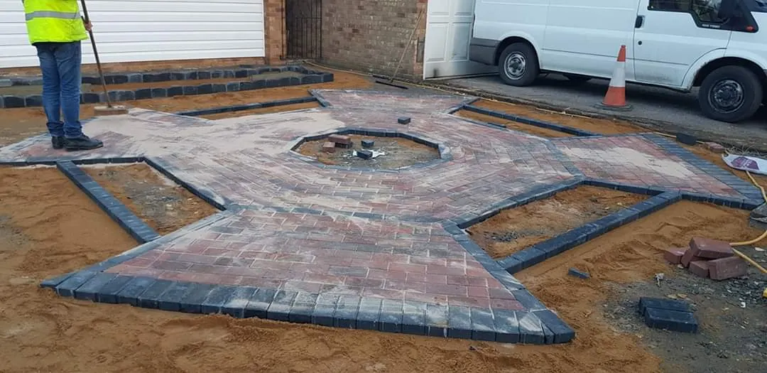 Block paving star feature being finished on a frontage