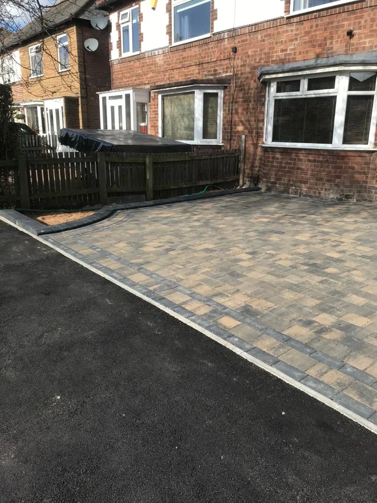 Brindle block paving driveway with a charcoal border at a semi-detached house