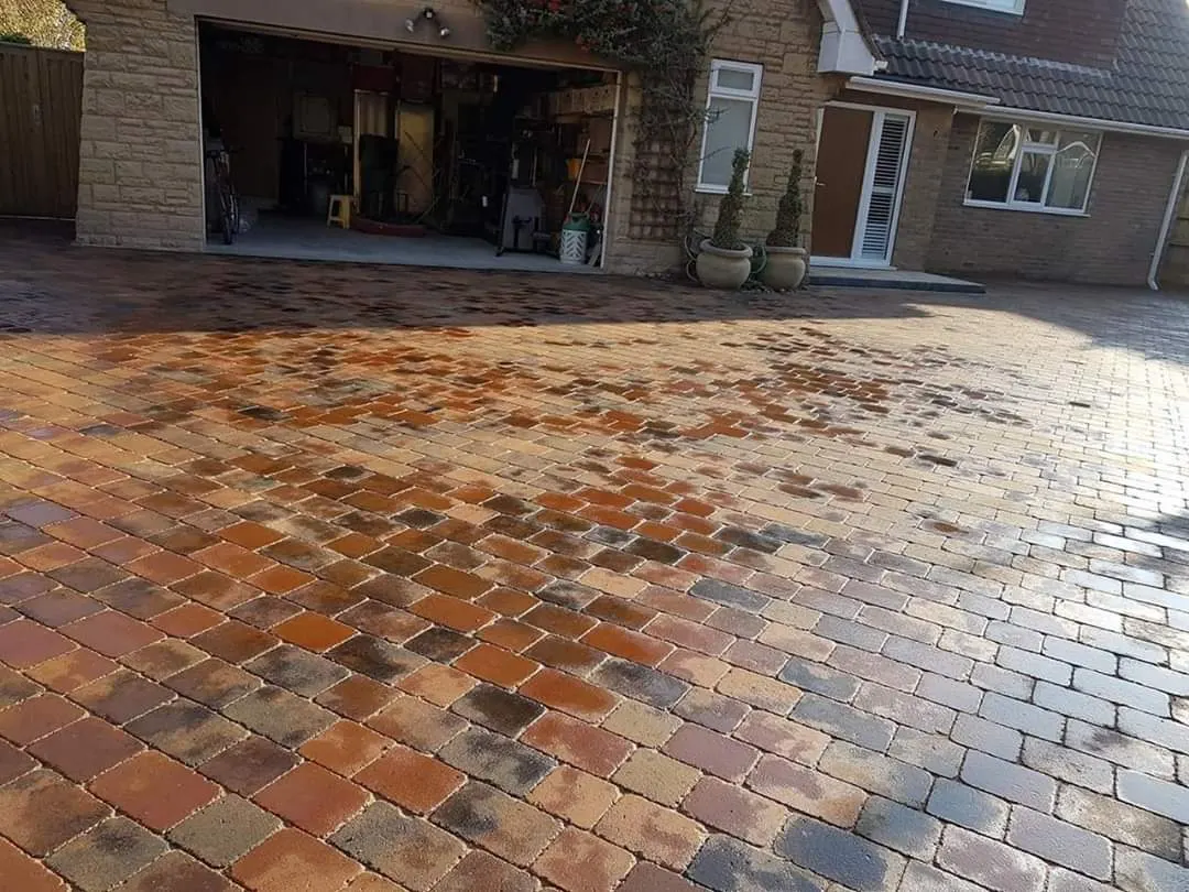 Brindle block paving driveway after rain