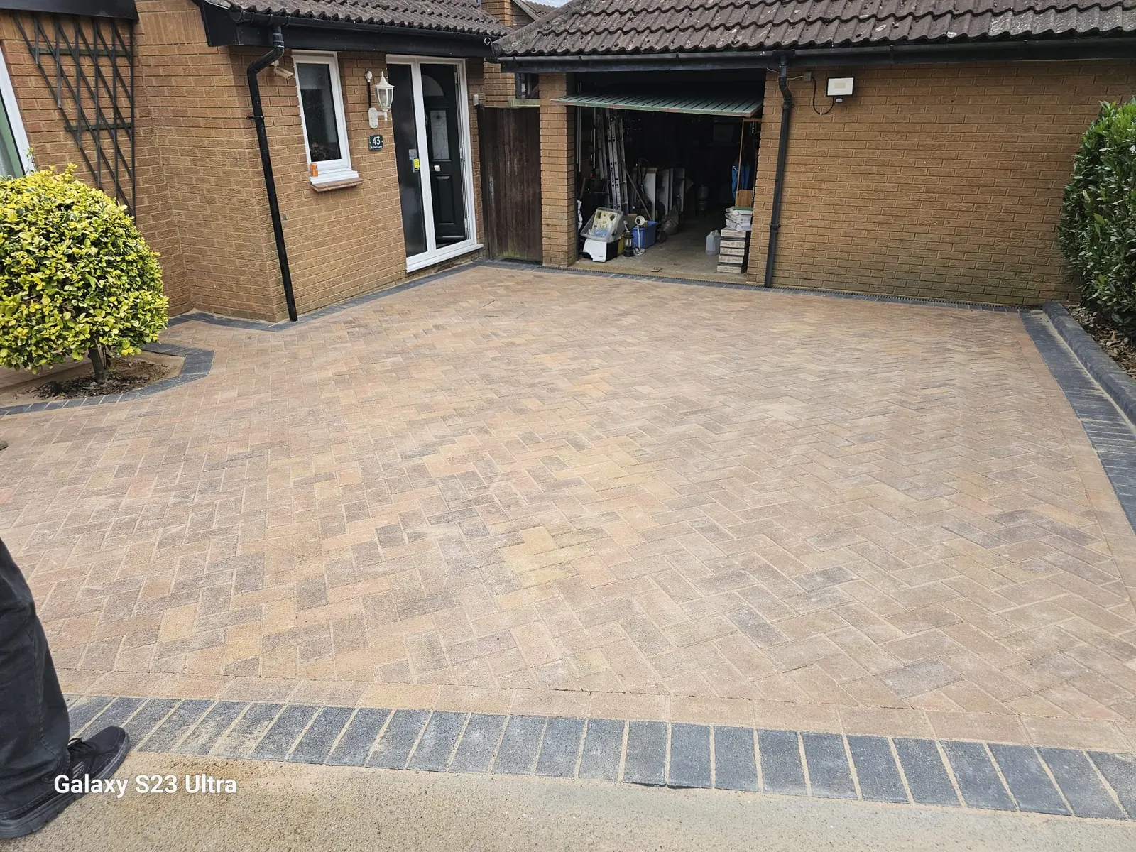 Brindle block paving in herringbone with a charcoal border