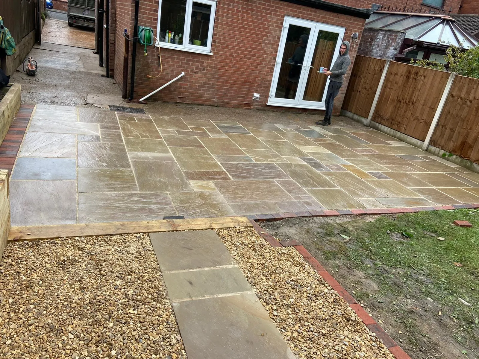 Buff sandstone patio with gravel and stepping slabs