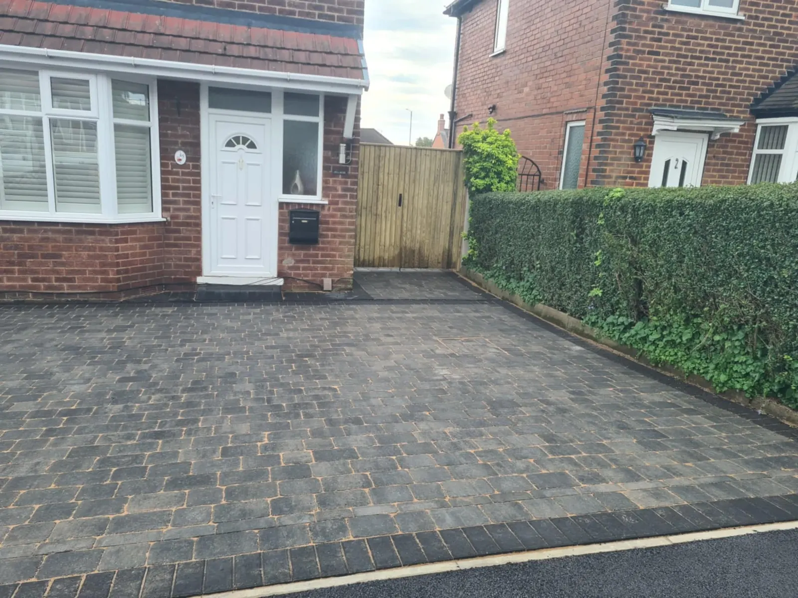 Charcoal block paving driveway at a semi-detached house