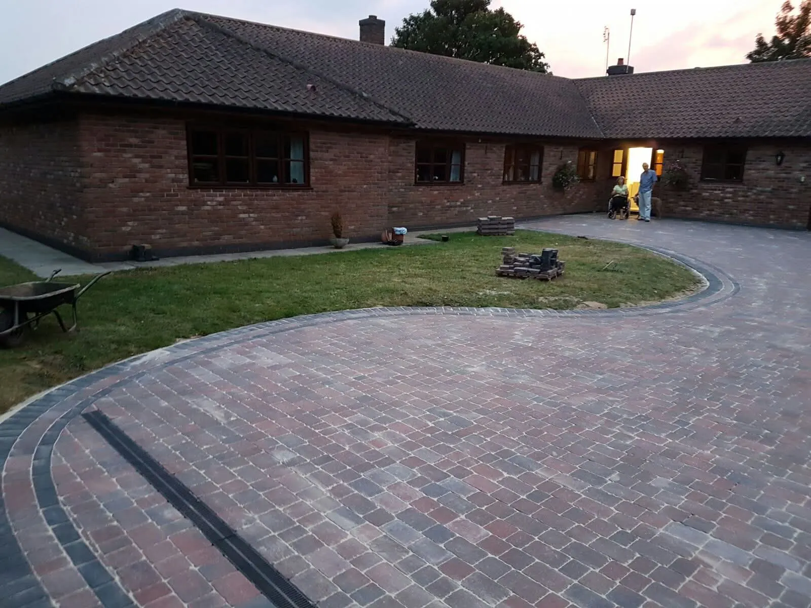 Curved brindle block paving driveway in front of a bungalow