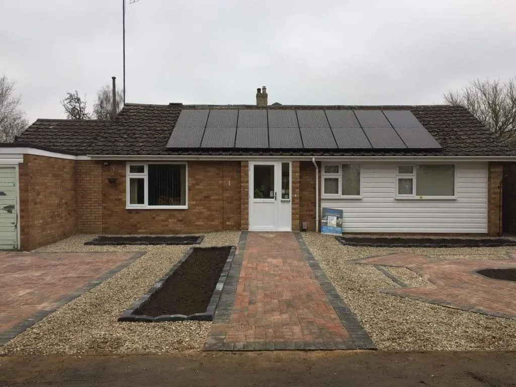 Gravel frontage with a block paving path and parking bay