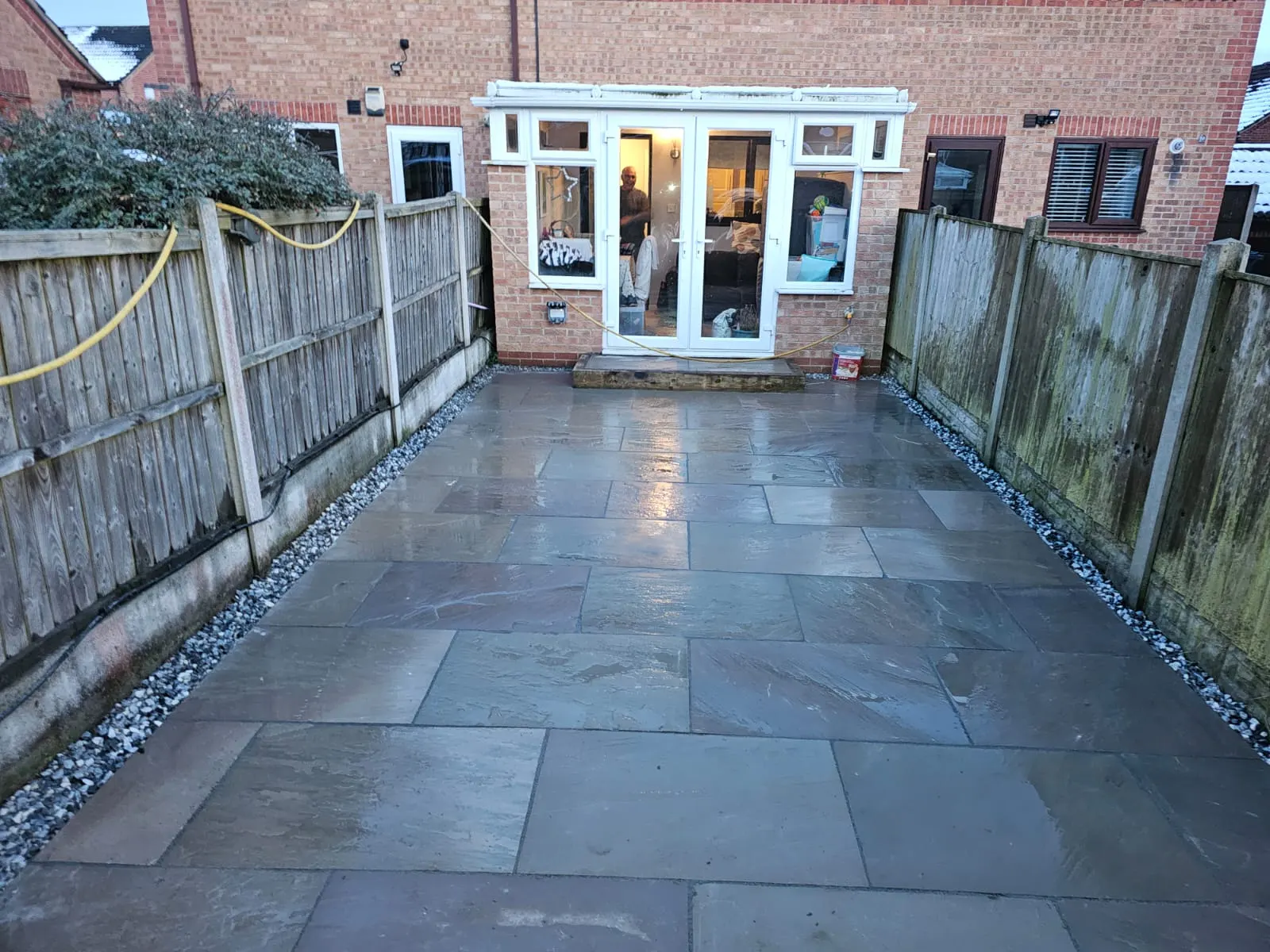 Grey porcelain patio filling a terraced back garden