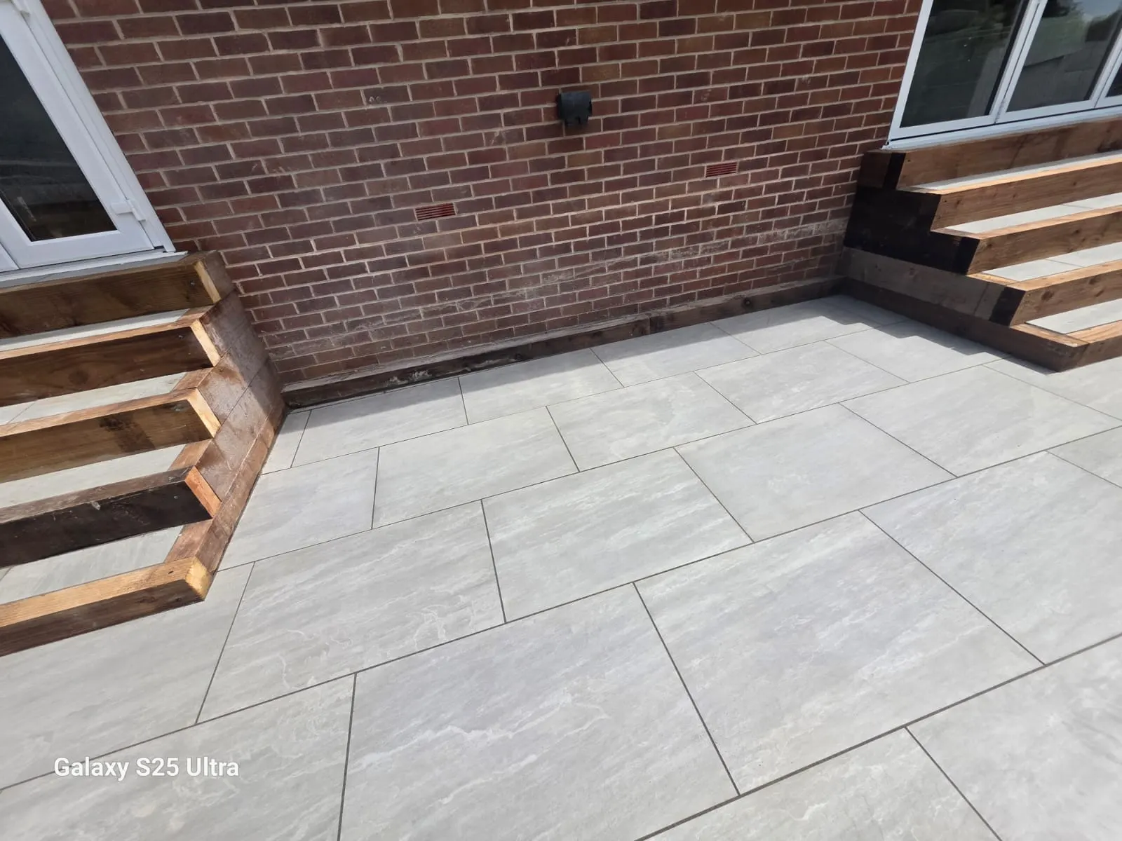 Grey porcelain patio with two flights of sleeper steps
