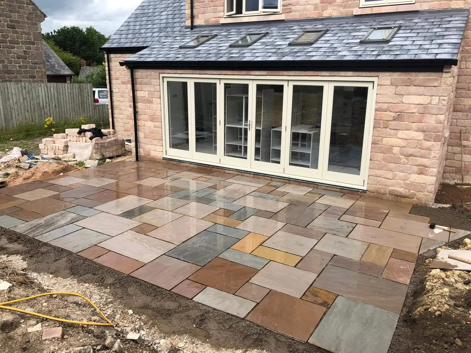 Indian sandstone patio laid outside a new rear extension