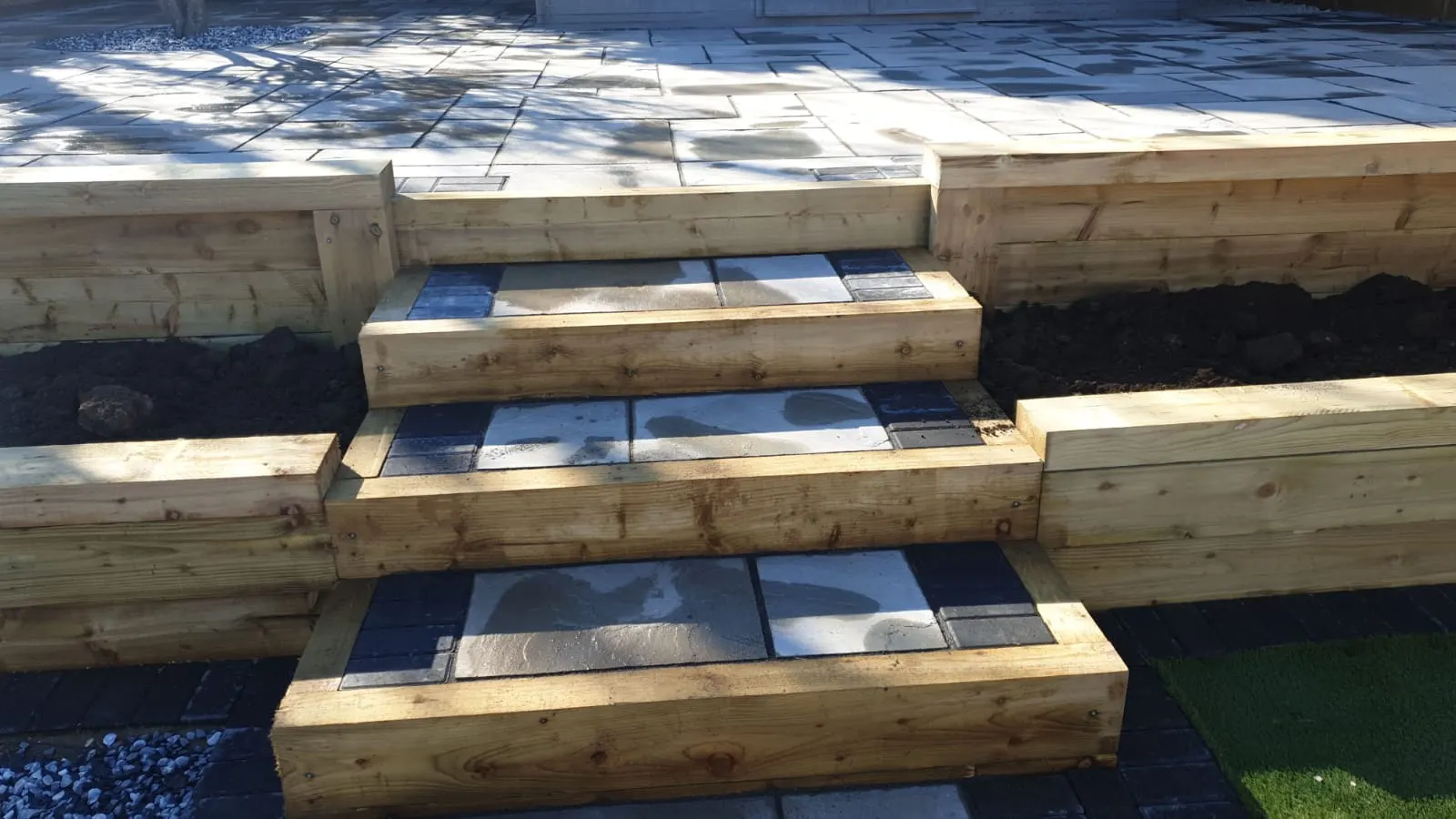 Timber sleeper steps with grey slab treads