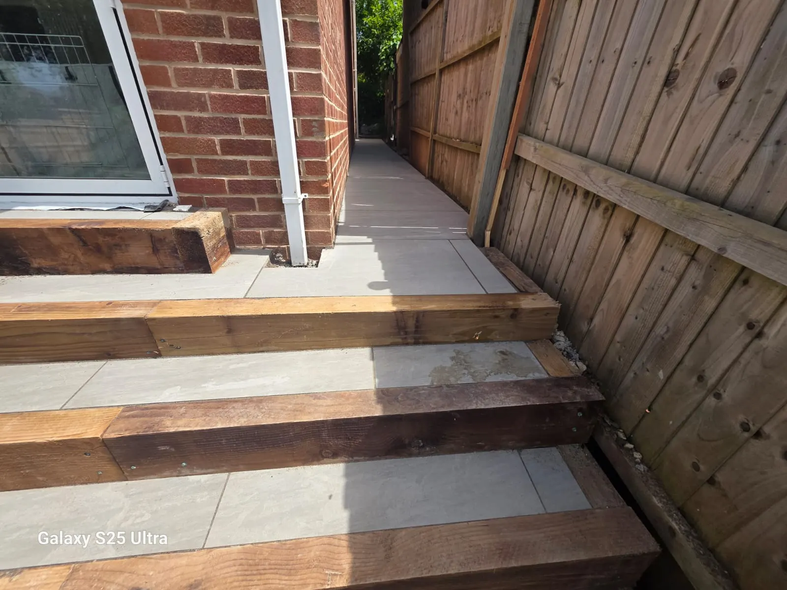 Sleeper steps with porcelain treads in a side passage