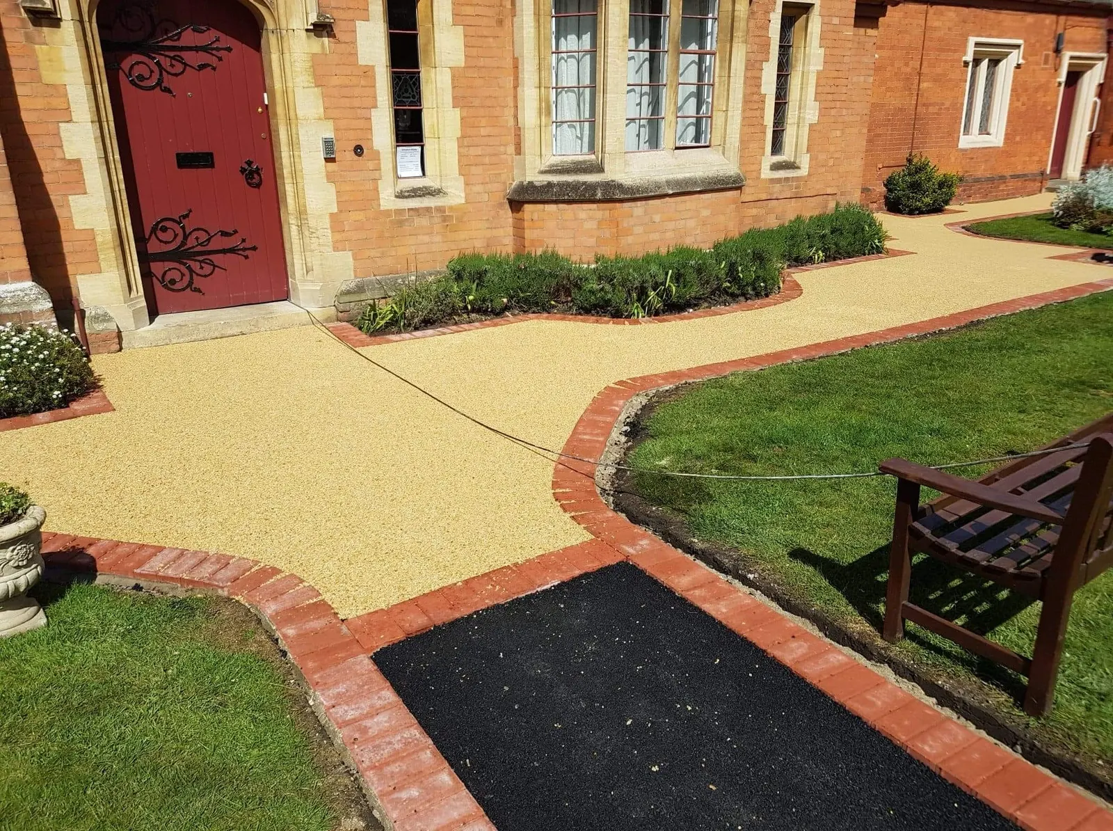 Tarmac and resin bound paths with red block paving edging
